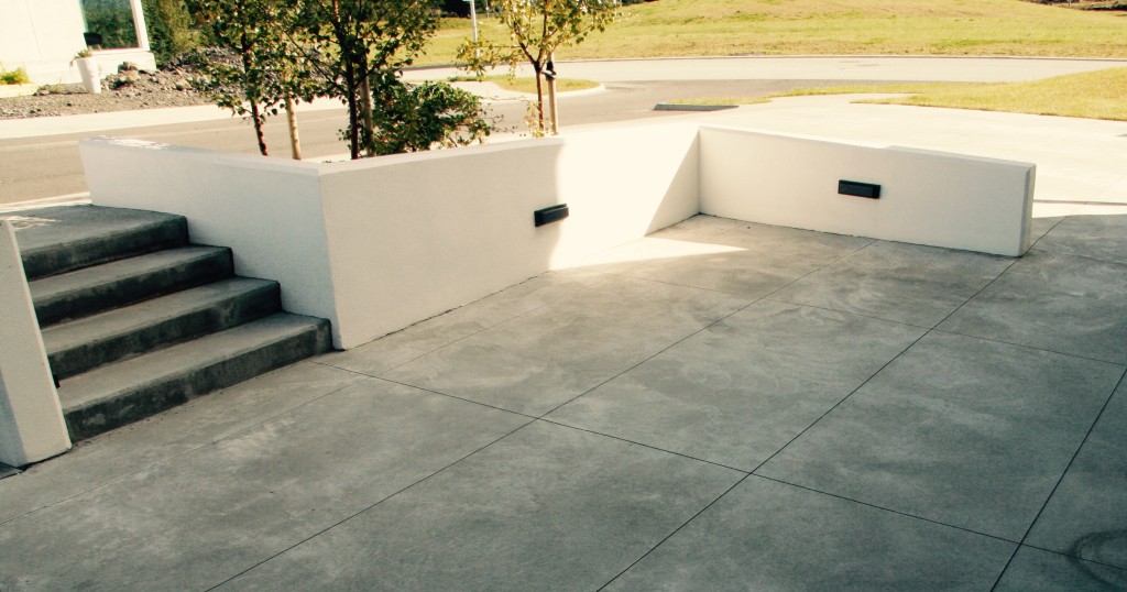 White retaining walls and cut concrete